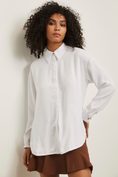 Oversized blouse with refined buttons